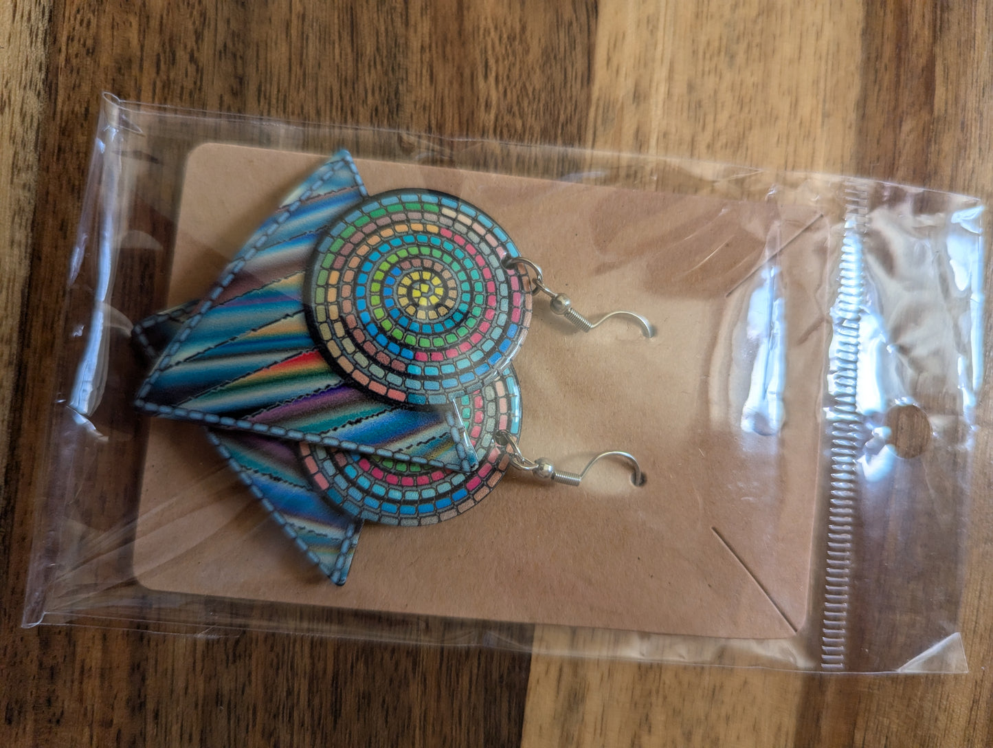 aztec drop earrings with tribal-inspired pattern shown as a single hanging statement jewellery piece