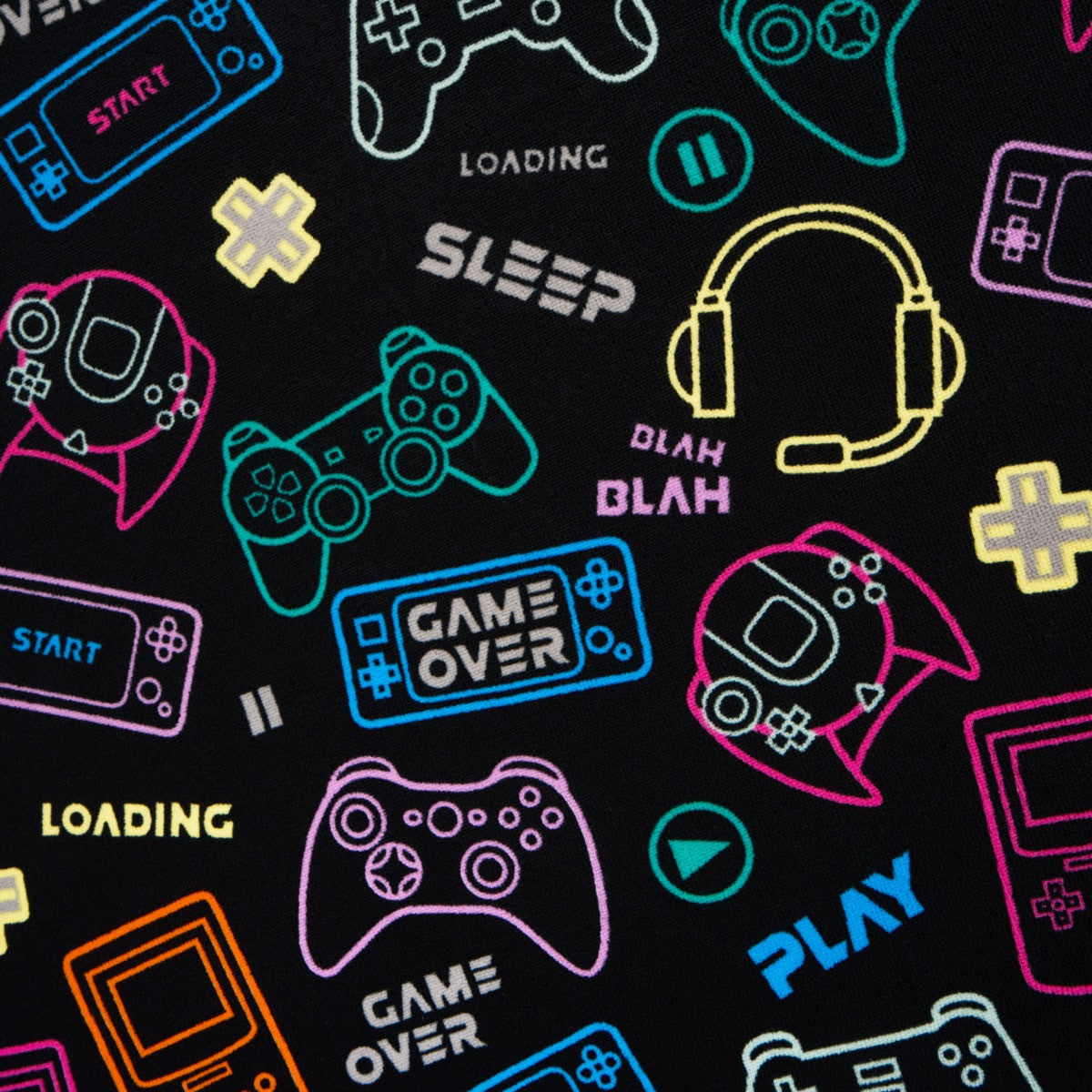 Close-up view of gaming-themed pattern on black microfibre beach towel for kids