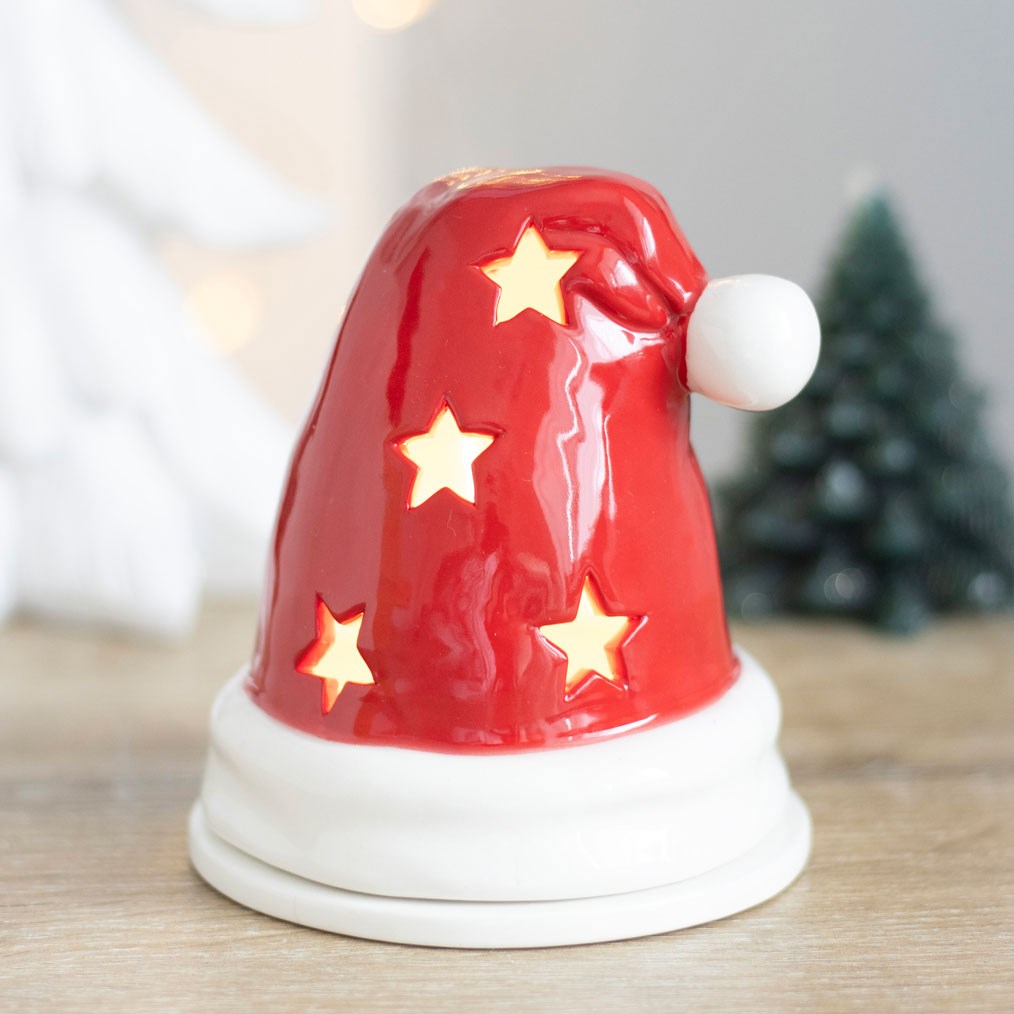 red Santa hat tealight holder and incense cone burner with star-shaped cut-outs
