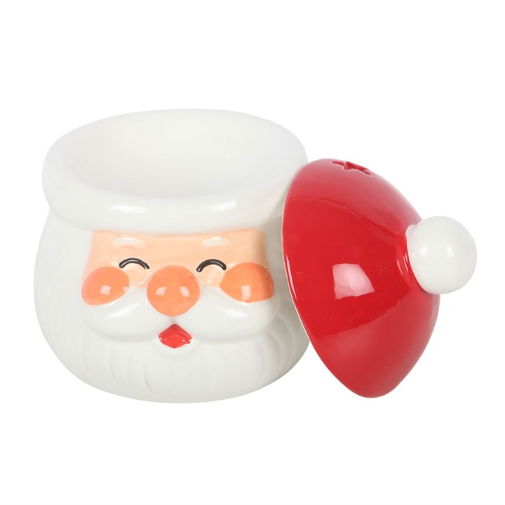 ceramic Christmas Santa oil burner and wax warmer with lid propped up.