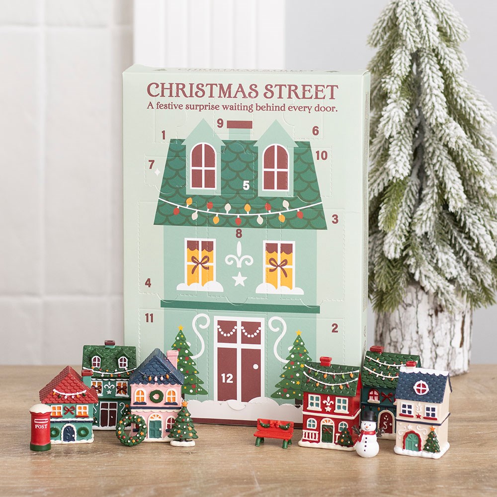 christmas street 12 day advent calendar with miniature festive houses and village scene