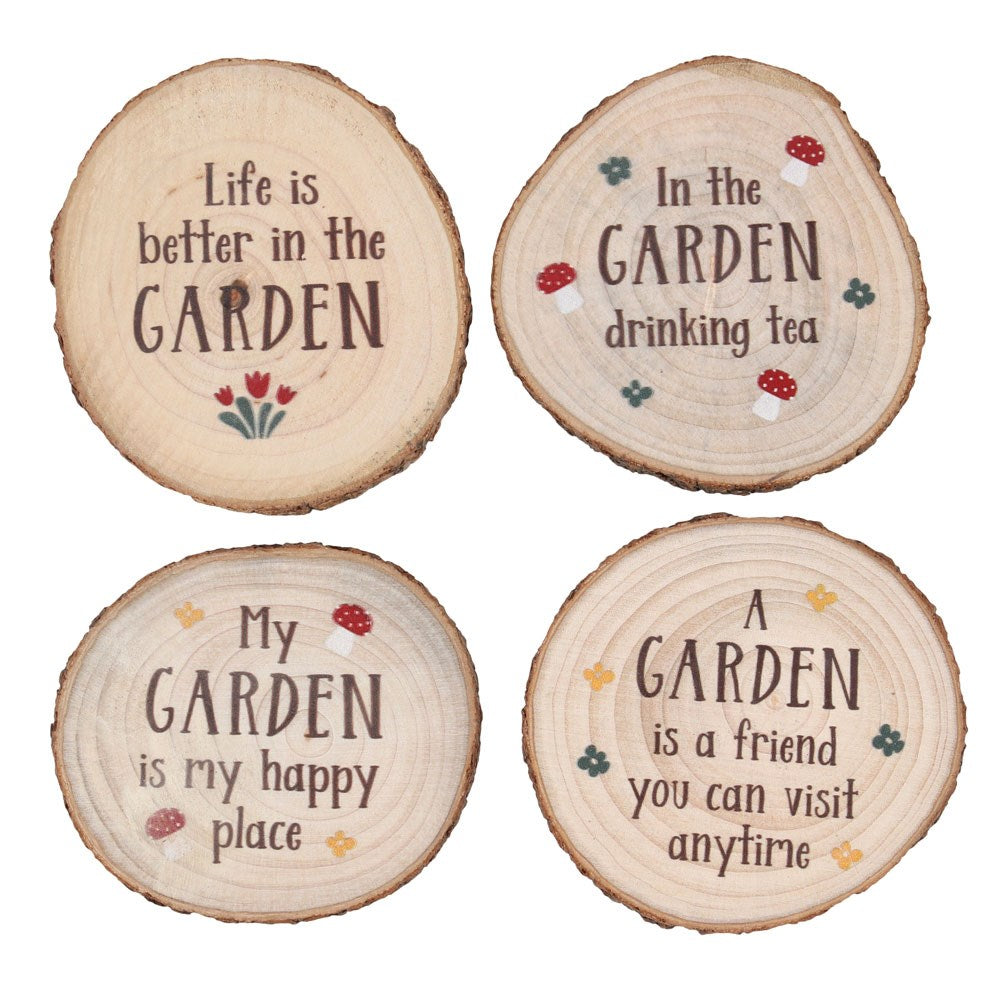 set of four rustic woodslice coasters with garden sentiments flowers leaves and toadstools