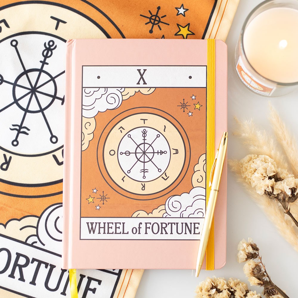 a5 vintage tarot notebook featuring the Wheel tarot card design and gold-edged pages