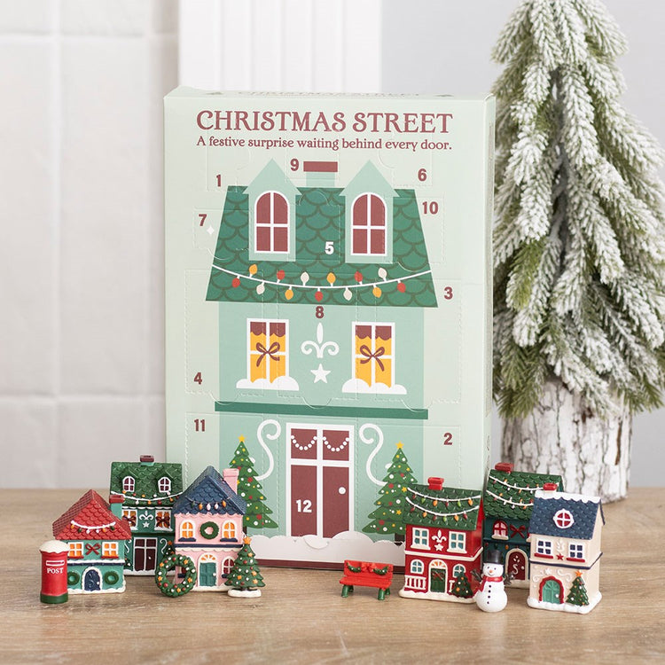 christmas street 12 day advent calendar with miniature festive houses and village scene