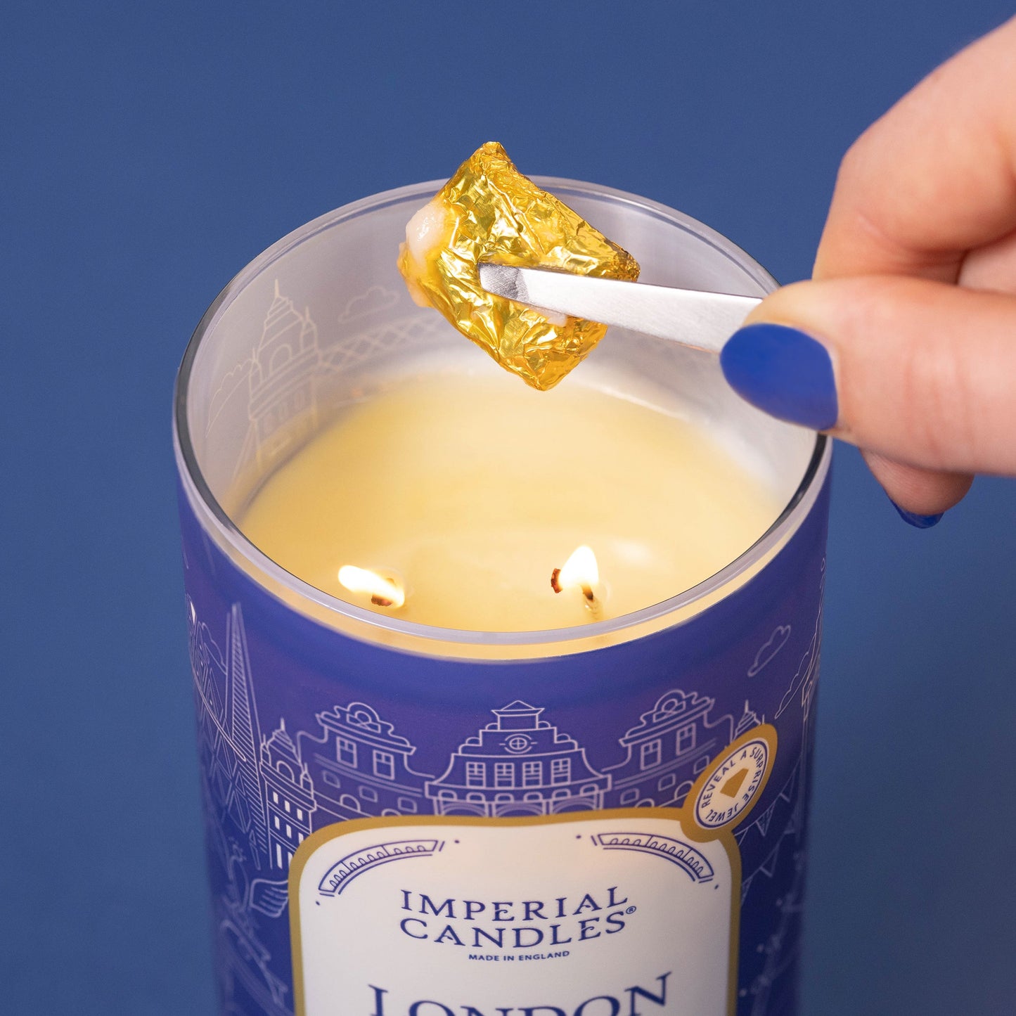 london imperial candle with necklace surprise lit showing jewellery pouch being removed
