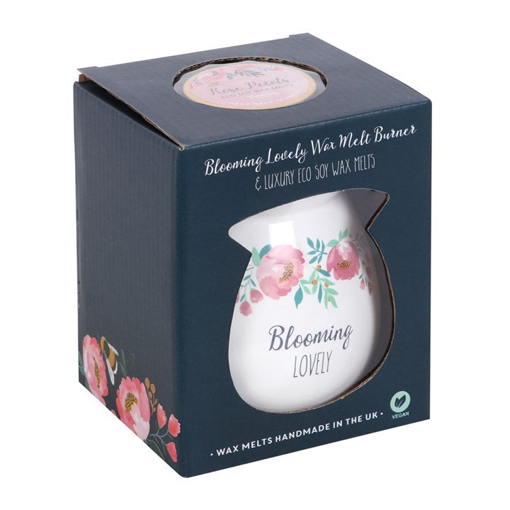 white ceramic oil burner with blooming lovely floral design front view