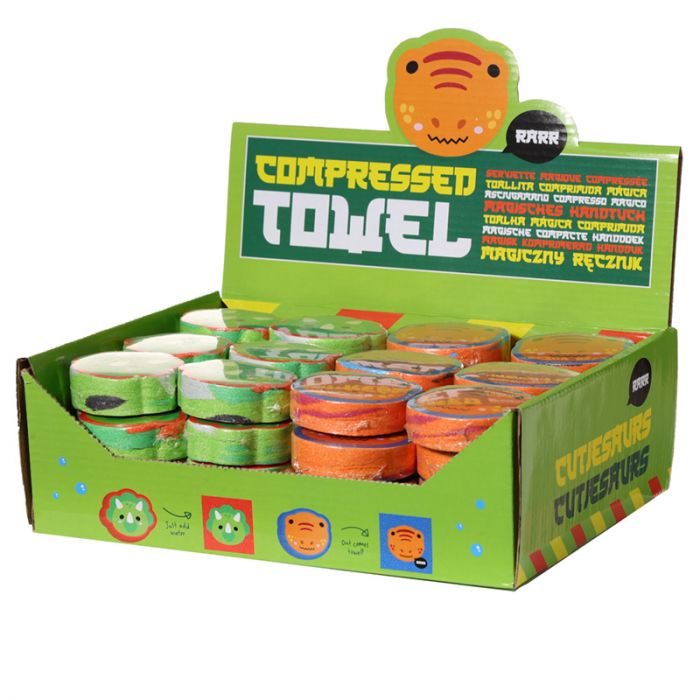 Dinosaur compressed travel towel assortment presented in cardboard display box for retail sale