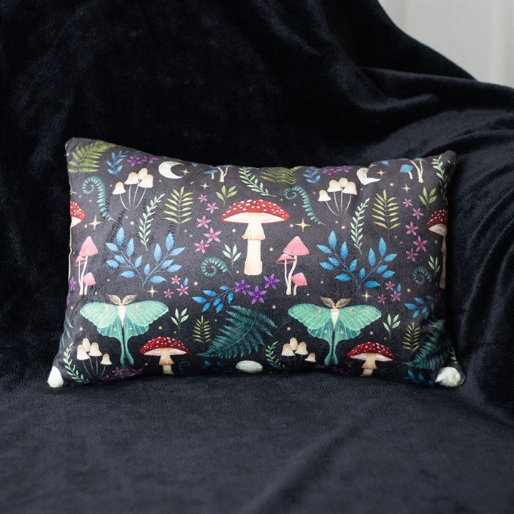 dark forest themed rectangular cushion shown styled on sofa for home decor display