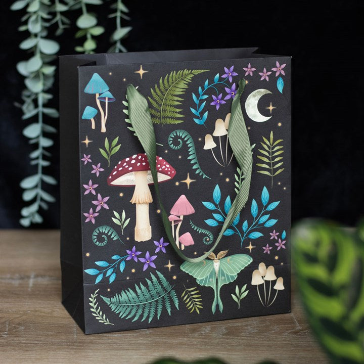 dark forest gift bag styled in magical woodland inspired setting for atmospheric gifting