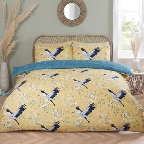 Cranes ochre double duvet cover set with printed crane design on bed, polyester microfibre bedding