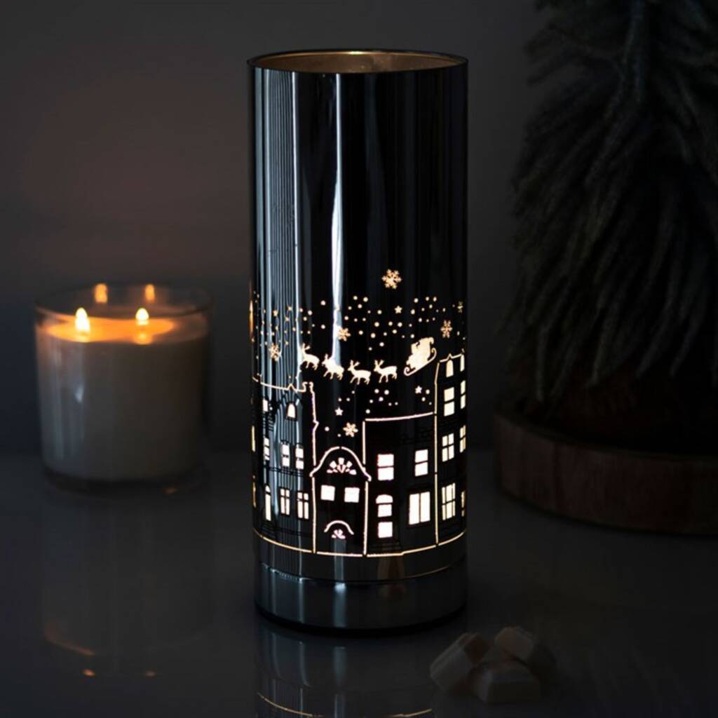 christmas village aroma lamp lit with festive village design for wax melts and oils