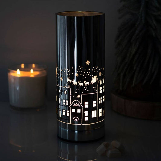 christmas village aroma lamp lit with festive village design for wax melts and oils
