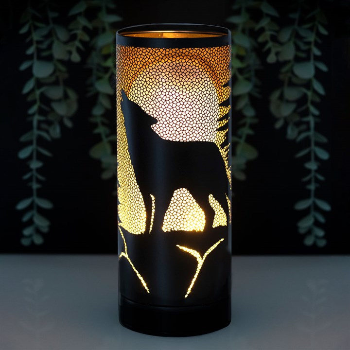 lisa parker wolf song metal aroma lamp lit in home setting showing wolf moon design