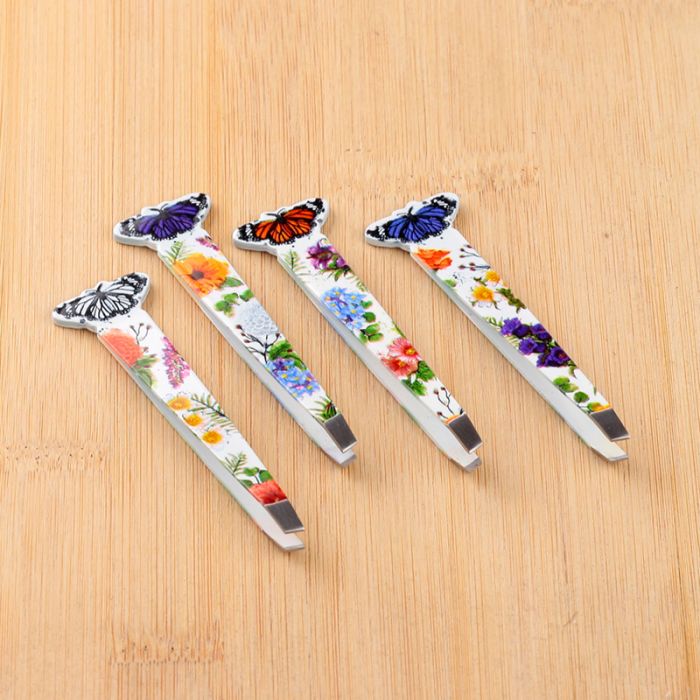 all four butterfly meadows tweezers variants displayed on a flat surface