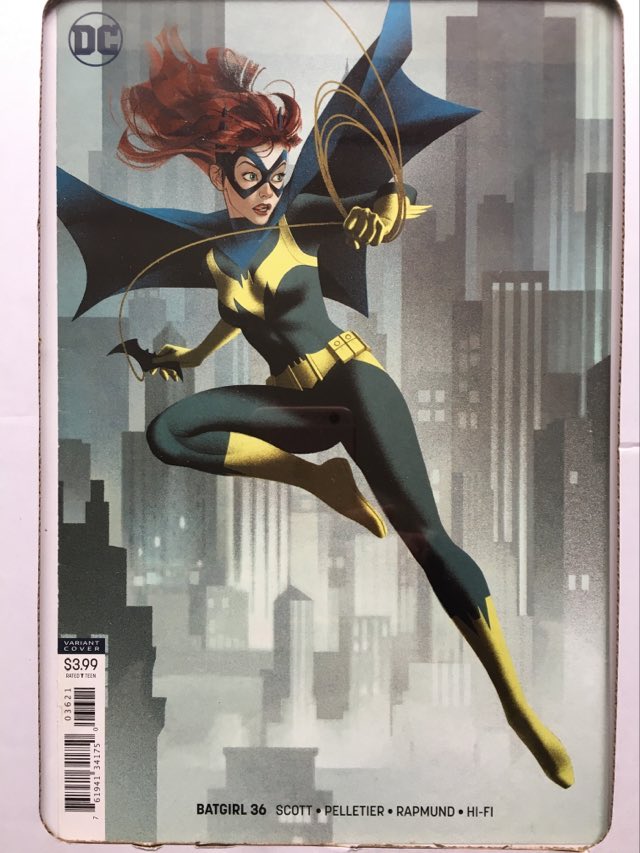 dc comics bat girl comic cover displayed in simple clip frame on wall