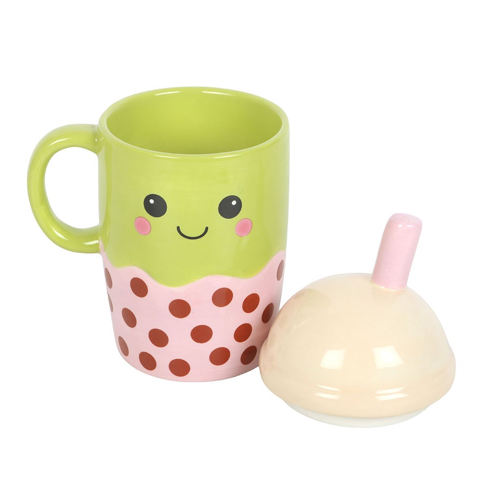 kawaii bubble tea mug with domed lid placed beside the mug