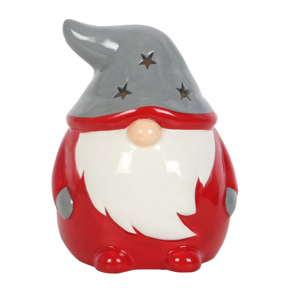 red and grey christmas gonk tealight holder with starry hat against a white background