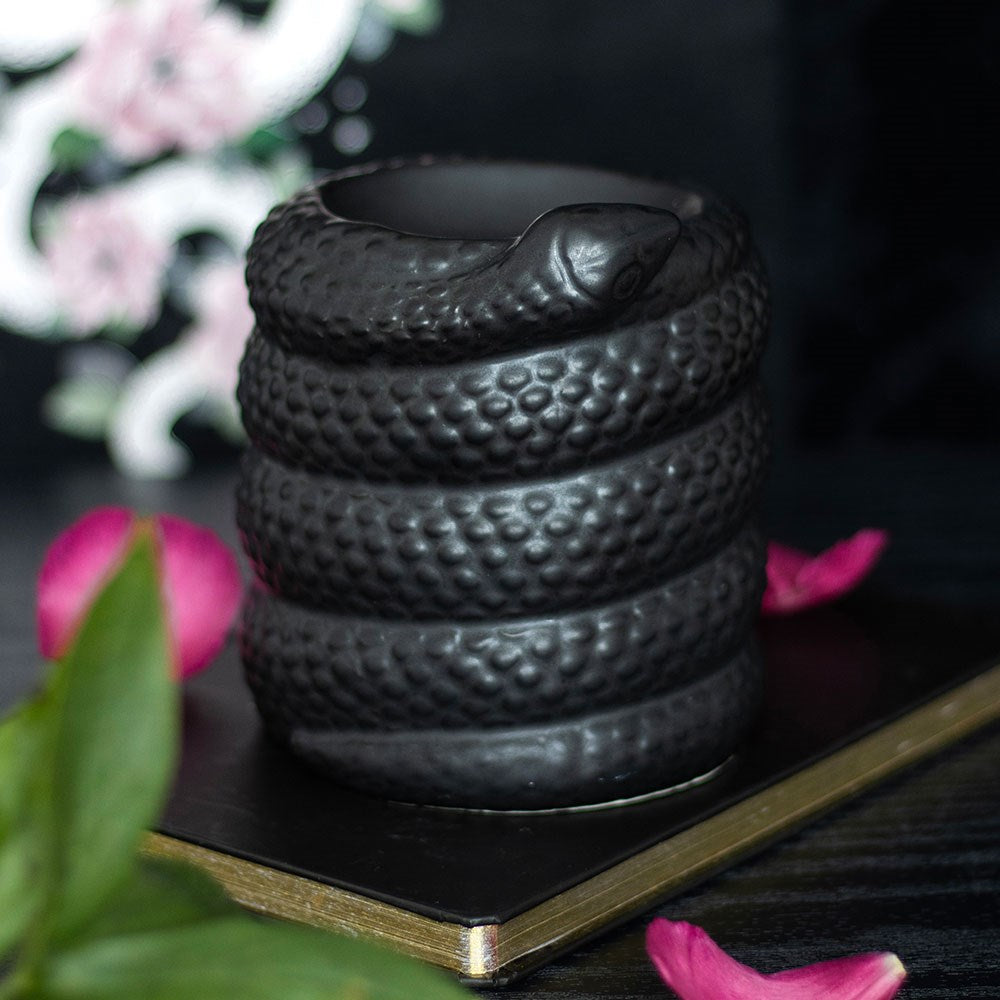 black ceramic oil burner and wax warmer shaped like a coiled snake