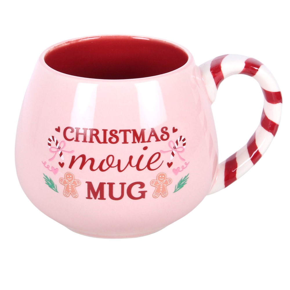 pink christmas movie mug featuring a festive design and candy cane style handle