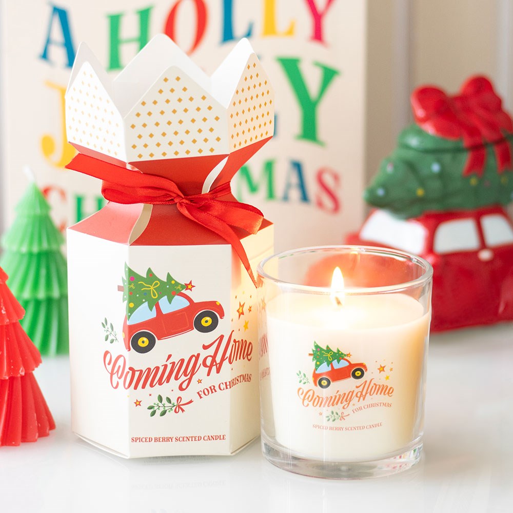christmas spiced berry candle beside its gift box in a festive setting