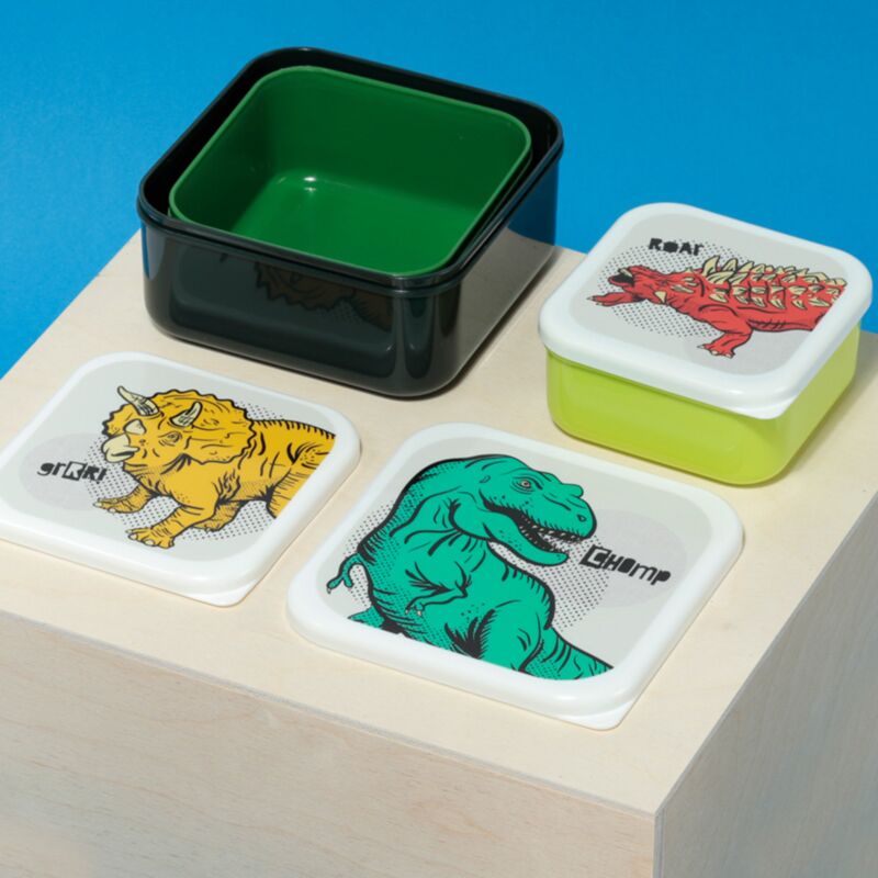 nested dinosaur lunch boxes with lids removed showing colourful dinosaur designs