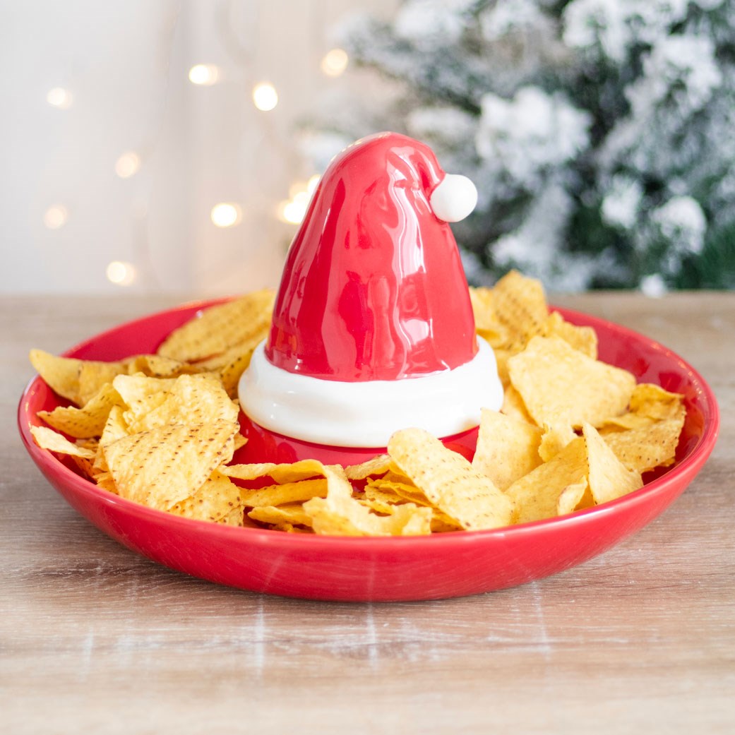 christmas santa hat chip and dip serving dish filled with tortilla chips in a festive setting