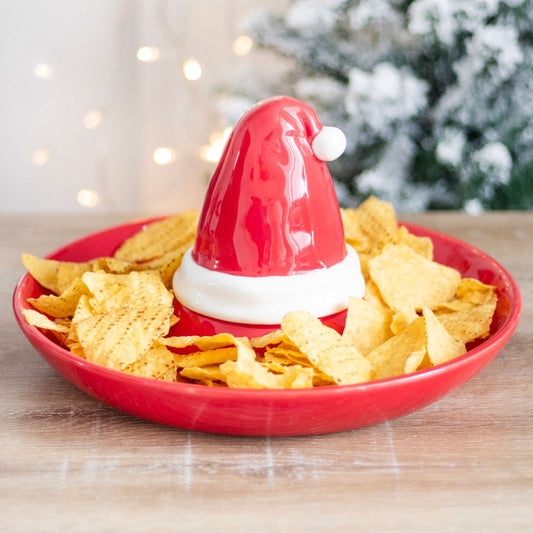 christmas santa hat chip and dip serving dish filled with tortilla chips in a festive setting