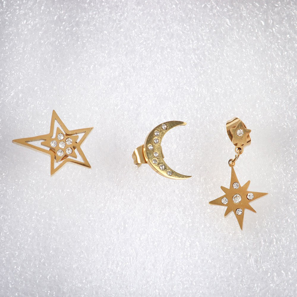 three different gold tone celestial earring designs displayed together