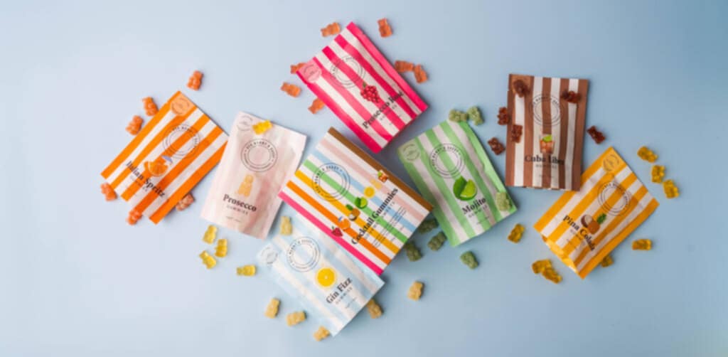 gourmet cocktail gummies with assorted flavours shown alongside loose gummies