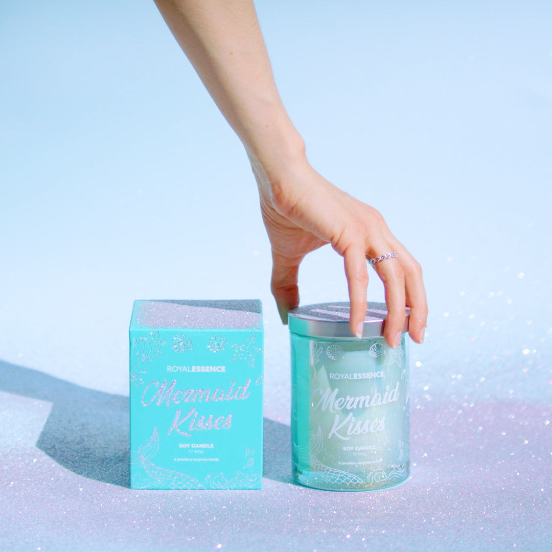 front view of royal essence mermaid kisses candle unboxed with silver lid