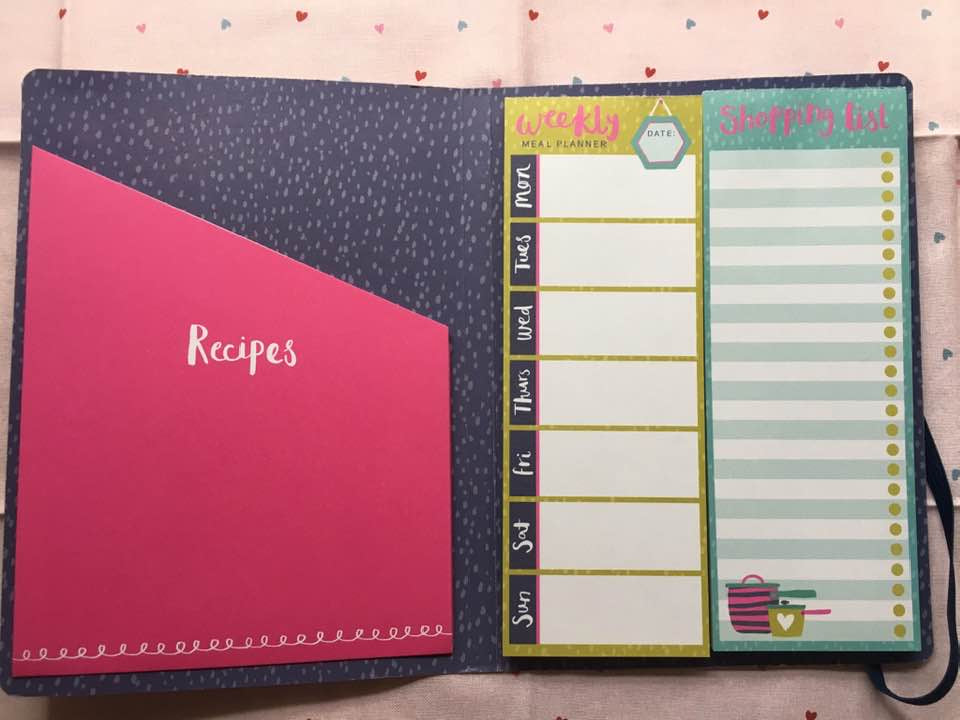 weekly meal planner organiser notebook opened showing lists and internal pages