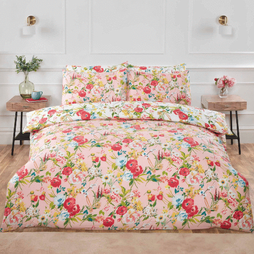 Floral blush Ashbourne duvet cover set on bed with soft pink floral pattern, double bedding set with matching pillowcases