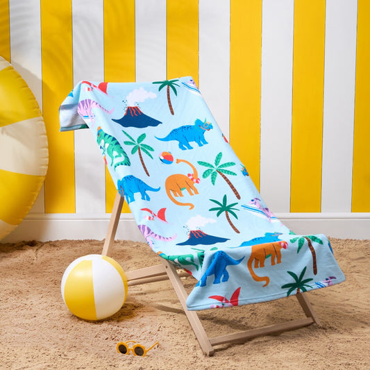 Children’s dinosaur microfibre beach towel with colourful dinosaurs on deckchair, kids quick-dry towel