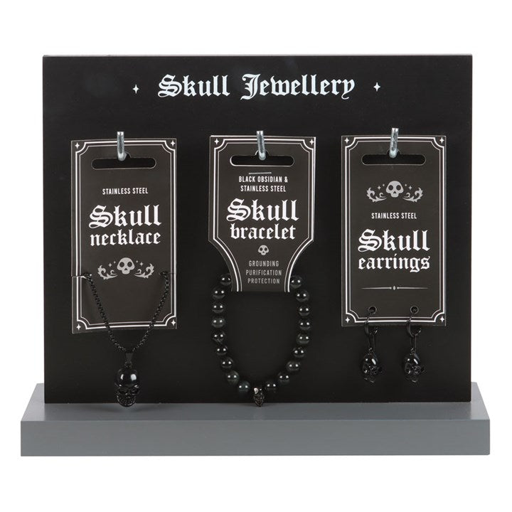 gothic skull jewellery displayed on stand featuring alternative stainless steel designs for everyday wear