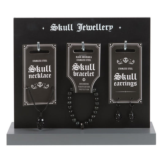gothic skull jewellery displayed on stand featuring alternative stainless steel designs for everyday wear