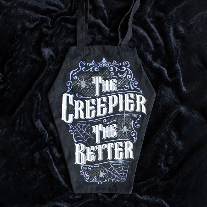 gothic coffin bag featuring bold slogan displayed on black fabric background
