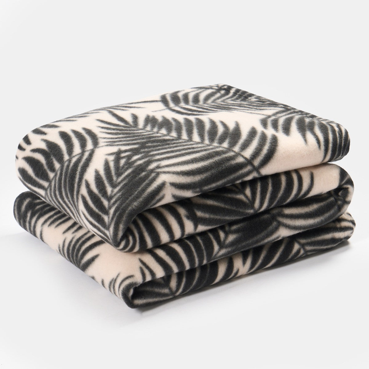 palm leaf fleece throw blanket folded showing soft texture and decorative pattern