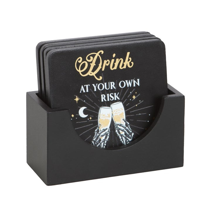 skull themed coasters displayed upright in holder creating bold table statement
