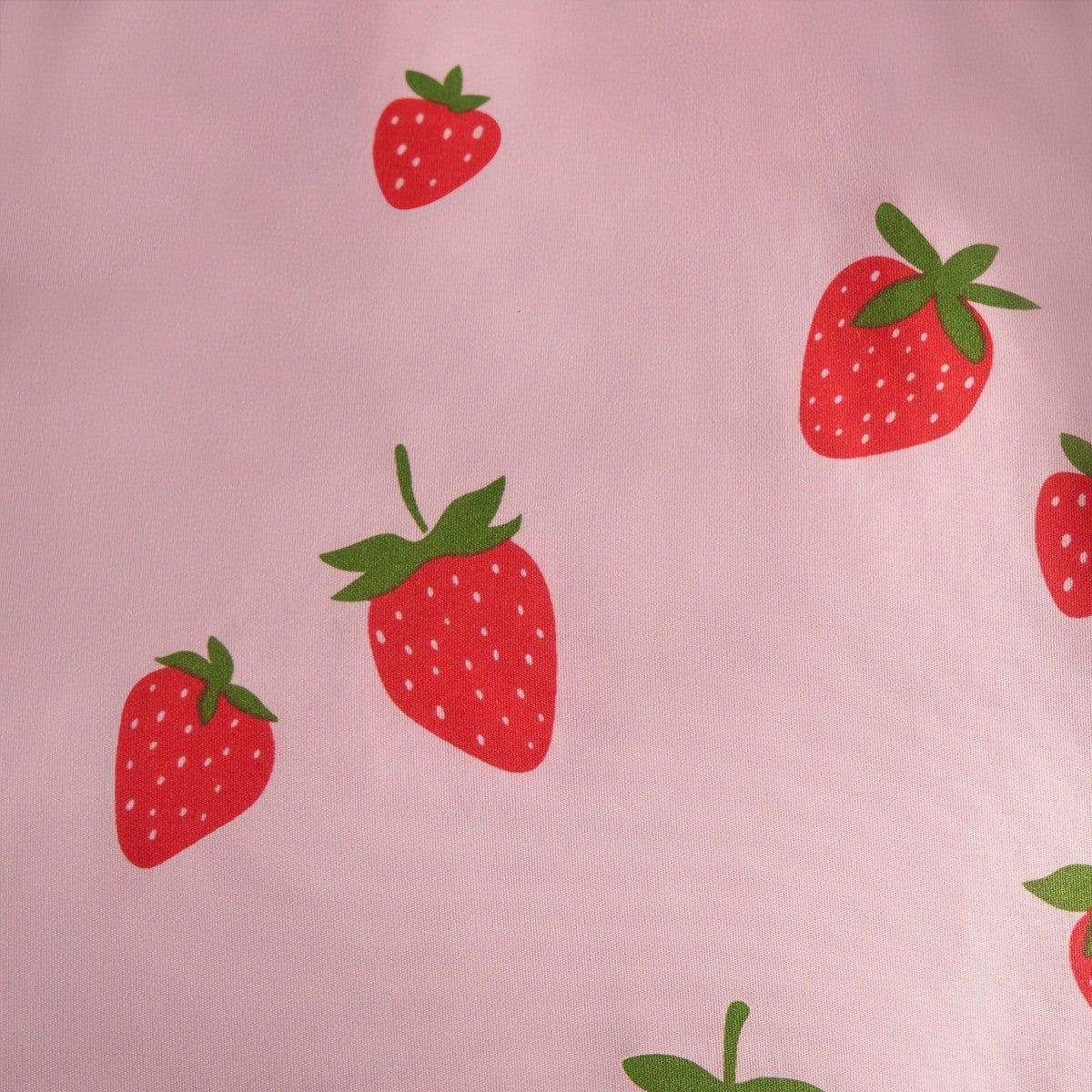 Close-up of strawberry print on children’s reversible duvet cover