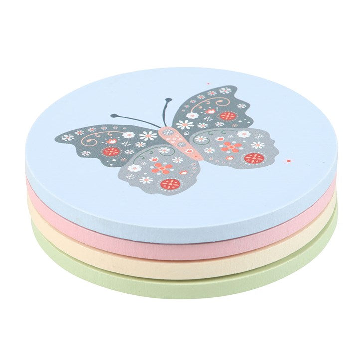 stacked floral bug coasters showing decorative insect themed tabletop accessories