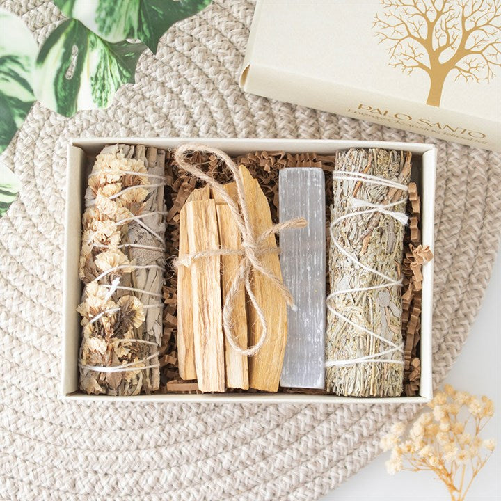 palo santo and sage energy cleansing kit contents displayed inside gift box