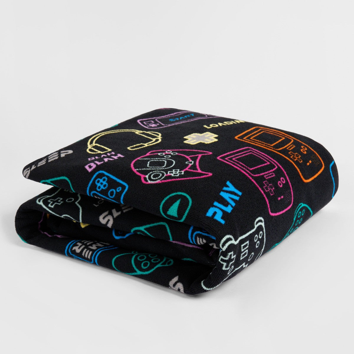 Folded black console gamer microfibre towel, compact children’s gaming beach towel