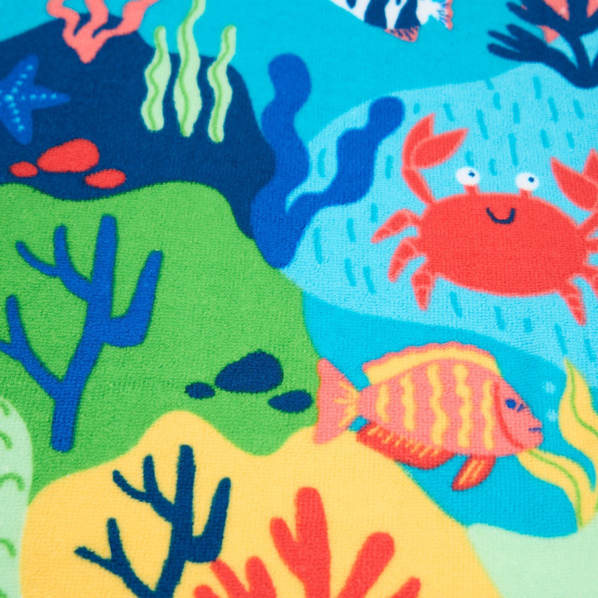 detailed close-up of nautical beach towel design with sea life illustrations