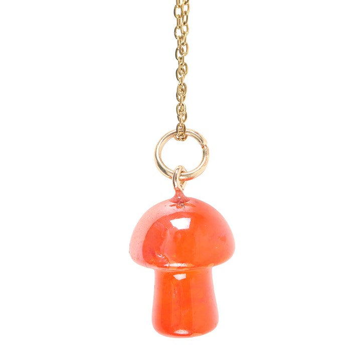 close up of mushroom aura pendant highlighting symbolic design and smooth finish