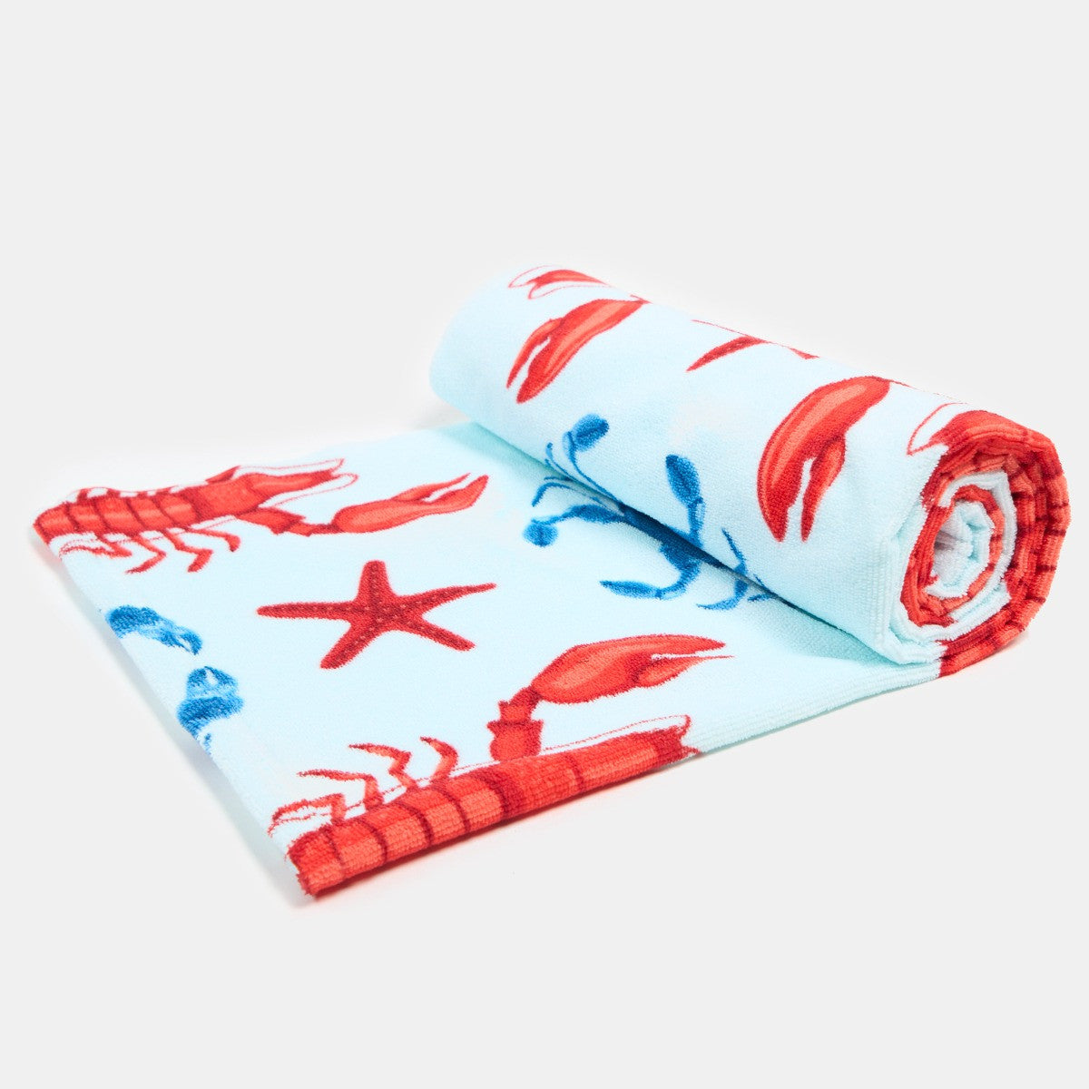 Rolled lobster print beach towel showing vibrant blue colour and pattern