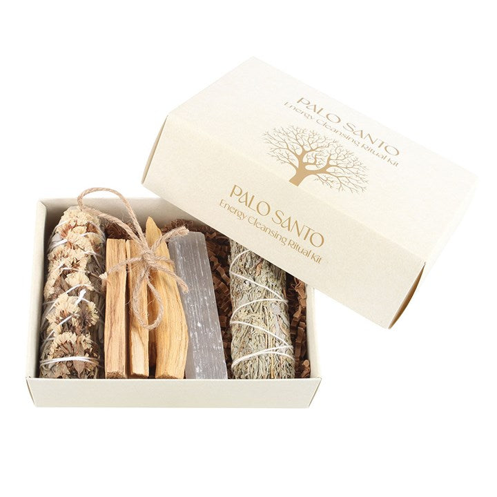 opened palo santo and sage cleansing set showing sticks bundles and selenite crystal