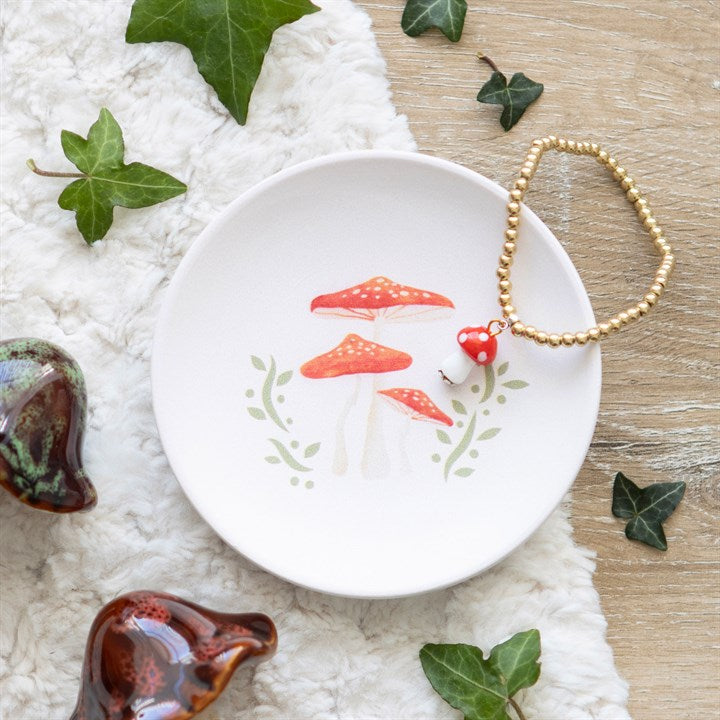 mushroom trinket dish styled in home setting with whimsical woodland illustration
