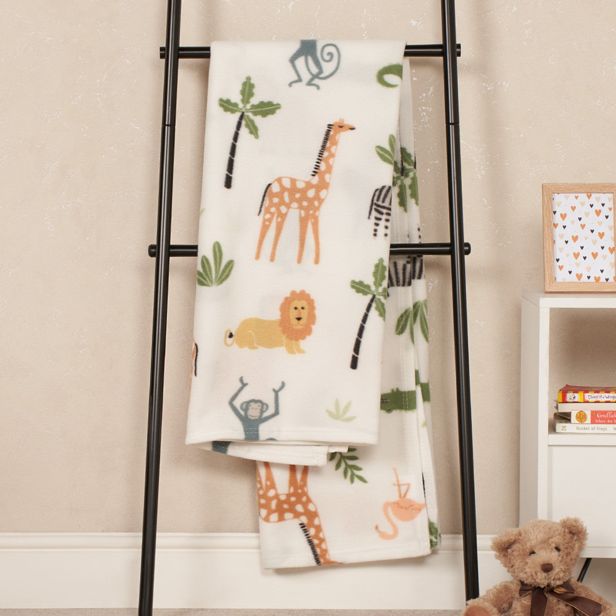 safari fleece throw in a home setting draped over furniture with soft lighting
