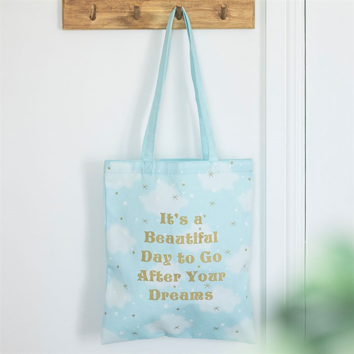 cloud print tote bag hanging in home setting positive message lightweight everyday accessory