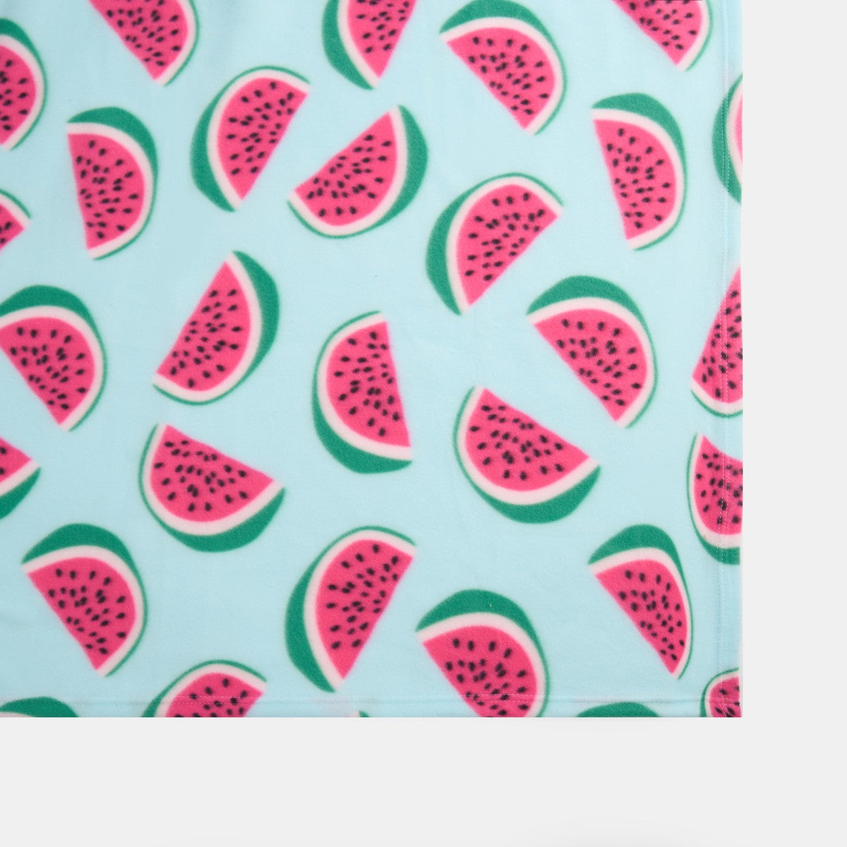 close-up view of watermelon fleece throw with focus on texture and print